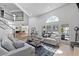 Spacious living area featuring high ceilings, large windows, and comfortable seating at 15 Pheasant Ridge Dr, Henderson, NV 89014