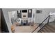 Open-concept living room featuring fireplace, bright windows, hardwood floors, and modern furniture at 15 Pheasant Ridge Dr, Henderson, NV 89014