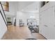 Open-concept living area with wood floors, white walls, and abundant natural light at 15 Pheasant Ridge Dr, Henderson, NV 89014