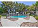 Private pool area with secure fencing and lush landscaping, creating a relaxing outdoor retreat at 15 Pheasant Ridge Dr, Henderson, NV 89014