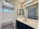 Modern bathroom featuring tile floors, a tub and shower combo, and a sleek vanity at 1509 Linnbaker Ln # 102, Las Vegas, NV 89110