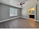 This bedroom features modern flooring, a ceiling fan, and an ensuite bathroom at 1509 Linnbaker Ln # 102, Las Vegas, NV 89110