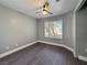 Neutral bedroom featuring a ceiling fan and a window with blinds at 1509 Linnbaker Ln # 102, Las Vegas, NV 89110