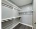 Walk-in closet with built-in shelving and ample storage space for clothes and accessories at 1509 Linnbaker Ln # 102, Las Vegas, NV 89110