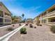 Exterior view of the apartment complex in a desert landscape at 1509 Linnbaker Ln # 102, Las Vegas, NV 89110