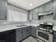 The kitchen has modern appliances, light countertops, stainless steel sink and ample natural light at 1509 Linnbaker Ln # 102, Las Vegas, NV 89110