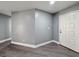 Inviting living room features gray walls, white trim and luxury vinyl plank flooring at 1509 Linnbaker Ln # 102, Las Vegas, NV 89110