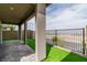 Covered patio area with cobblestone flooring and artificial turf at 1596 Pacific Baza St, Las Vegas, NV 89138