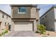 Modern two-story home featuring a two-car garage and low maintenance front yard at 1596 Pacific Baza St, Las Vegas, NV 89138