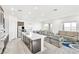 Bright, open-concept space seamlessly connects the kitchen, dining, and living areas at 1596 Pacific Baza St, Las Vegas, NV 89138