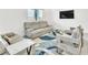 Living room showcasing modern furnishings and a view from the balcony at 1596 Pacific Baza St, Las Vegas, NV 89138