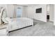 Spacious bedroom featuring a king-size bed, a TV, and neutral color palette at 1596 Pacific Baza St, Las Vegas, NV 89138