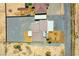 Birds eye view of modern home featuring landscaping, driveways, and a spacious lot in a desert community at 1801 S Manzanita Dr, Pahrump, NV 89048