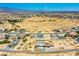Expansive aerial view showcases homes and spacious lots in a developing community with mountain views at 1801 S Manzanita Dr, Pahrump, NV 89048