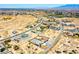 Overhead view depicts a developing desert community with homes, lots, and infrastructure against a scenic backdrop at 1801 S Manzanita Dr, Pahrump, NV 89048