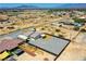 Aerial shot of a home and fenced yard on a desert property, backed by mountains on the horizon at 1801 S Manzanita Dr, Pahrump, NV 89048