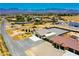Mountain view property of a desert neighborhood featuring a large fenced yard and metal awning at 1801 S Manzanita Dr, Pahrump, NV 89048