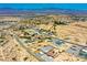 Wide aerial view highlighting the community's layout and landscape with a network of roads and desert scenery at 1801 S Manzanita Dr, Pahrump, NV 89048