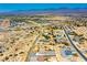 Scenic aerial view featuring homes and ample land, highlighting the developing neighborhood's potential at 1801 S Manzanita Dr, Pahrump, NV 89048