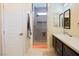Sleek bathroom features glass enclosed shower with a stone floor and quartz countertop vanity at 1801 S Manzanita Dr, Pahrump, NV 89048