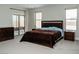 Bright bedroom featuring a sliding glass door to the patio, carpet flooring, and light walls at 1801 S Manzanita Dr, Pahrump, NV 89048