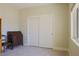 Bedroom featuring a closet with sliding doors and neutral walls at 1801 S Manzanita Dr, Pahrump, NV 89048
