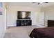 Spacious bedroom with neutral carpet and contemporary decor, offering comfort and style at 1801 S Manzanita Dr, Pahrump, NV 89048