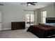 Spacious bedroom features access to the patio and a large dresser for ample storage at 1801 S Manzanita Dr, Pahrump, NV 89048