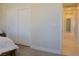 Bedroom featuring a closet with sliding doors and a hallway at 1801 S Manzanita Dr, Pahrump, NV 89048
