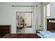 Bedroom with sliding glass door, dresser and nightstand, perfect for relaxation at 1801 S Manzanita Dr, Pahrump, NV 89048