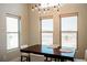 Bright dining room featuring a modern light fixture with many windows providing natural light and views at 1801 S Manzanita Dr, Pahrump, NV 89048