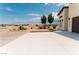 Spacious driveway surrounded by desert landscaping at 1801 S Manzanita Dr, Pahrump, NV 89048