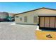 Side angle of home showing RV parking and gravel yard with a view of the sunroom at 1801 S Manzanita Dr, Pahrump, NV 89048
