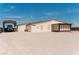 Exterior of the property with a large driveway and carport at 1801 S Manzanita Dr, Pahrump, NV 89048