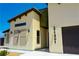 Close up of modern exterior showcasing unique architectural features, windows, and desert landscaping at 1801 S Manzanita Dr, Pahrump, NV 89048