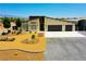 Beautiful single-story home featuring a two-car garage and professionally landscaped front yard at 1801 S Manzanita Dr, Pahrump, NV 89048