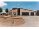 Charming single-story home features desert landscaping, a spacious driveway and a two-car garage at 1801 S Manzanita Dr, Pahrump, NV 89048