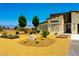 Southwest style home showcasing the front yard with desert landscaping and modern design at 1801 S Manzanita Dr, Pahrump, NV 89048