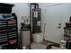 A garage space featuring a water heater, storage, and tools at 1801 S Manzanita Dr, Pahrump, NV 89048
