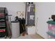 Garage interior featuring a water heater at 1801 S Manzanita Dr, Pahrump, NV 89048