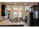 Modern kitchen with stainless steel appliances, quartz countertops, and stylish light fixtures at 1801 S Manzanita Dr, Pahrump, NV 89048