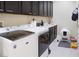 Functional laundry room with modern appliances, sink, and ample storage space at 1801 S Manzanita Dr, Pahrump, NV 89048