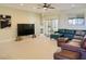 Spacious living room featuring tile floors, recessed lighting, and a comfortable sectional at 1801 S Manzanita Dr, Pahrump, NV 89048