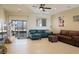 Bright, spacious living room featuring tile floors, recessed lighting, and comfortable furnishings at 1801 S Manzanita Dr, Pahrump, NV 89048
