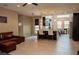 Expansive living room featuring tile floors, dark cabinetry in kitchen, and ample natural light at 1801 S Manzanita Dr, Pahrump, NV 89048