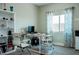 A functional office featuring a built-in bookshelf, desk with office chairs, and bright natural light at 1801 S Manzanita Dr, Pahrump, NV 89048