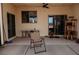 Covered patio has concrete flooring, outdoor seating, pet supplies, and cat furniture at 1801 S Manzanita Dr, Pahrump, NV 89048