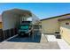 Oversized RV parking with covered structure next to the house and air conditioning units at 1801 S Manzanita Dr, Pahrump, NV 89048