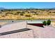 Detail of a roof showcasing tile work against a backdrop of desert community with clear skies at 1801 S Manzanita Dr, Pahrump, NV 89048