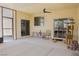 Enclosed sunroom offering lots of space with overhead lighting and patio door to the interior at 1801 S Manzanita Dr, Pahrump, NV 89048